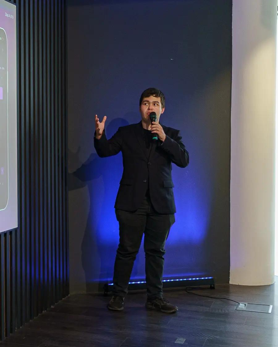 Dominik presenting on stage