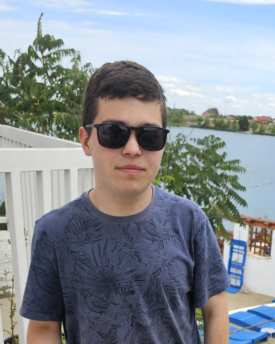 Dominik spending free time by a lake